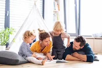 Family reading a book together