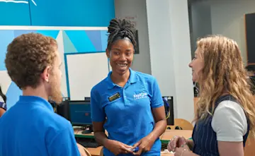 Two tutors speak with a manager