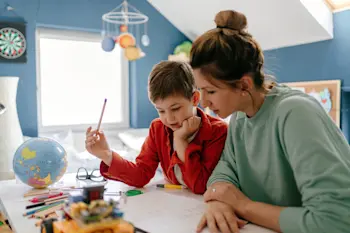 Mum helping child with homework