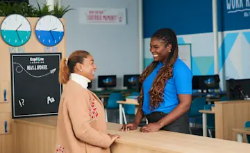 An Explore tutor chats with a parent