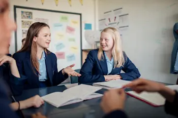 Teenagers working in a group on a presentation