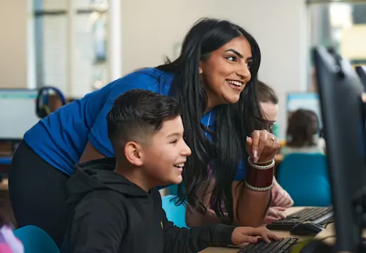 A female Explore Learning tutor works with a young boy to support him in preparing for 11 plus and entrance exams. 
