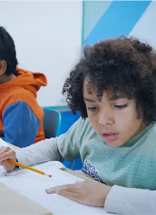 A child studying for their 11 Plus exam at an Explore Learning centre